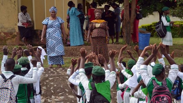 Teachers of Tundunwada Secondary School speak to students about Ebola during an assembly in Abuja on September 22, 2014.