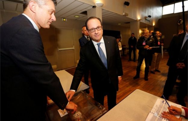 French President Francois Hollande casts his vote in the second round of 2017 French presidential election at a polling station in Tulle, France, May 7, 2017.