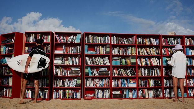 Red Ikea Billy bookcases set up on Australia's Bondi Beach in 2010