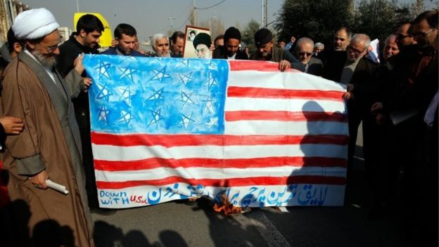 Iranians burn a US flag during a pro-government demonstration after the Friday prayer ceremony at the Imam Khomeini mosque in Tehran, Iran, 5 January 2018.
