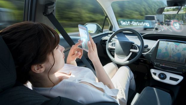 Women on phone in self-driving car