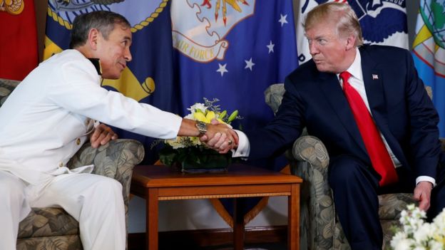 Donald Trump arrives to receive a briefing from US Navy Admiral Harry Harris (L), commander of United States Pacific Command, at its headquarters in Aiea, Hawaii, November 3, 2017.