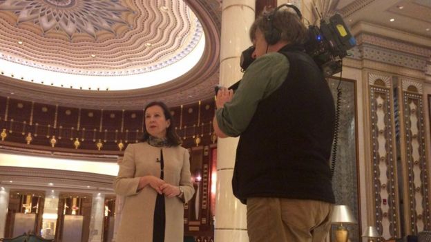LyseDoucet and Philip Goodwin record a piece to camera in the glitzy Ritz Carlton lobby in Riyadh.