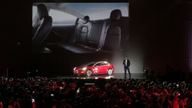 TeslaChief Executive Elon Musk introduces one of the first Model 3 cars off the Fremont factory's production line at the company's facilities in Fremont, California, on July 28, 2017.