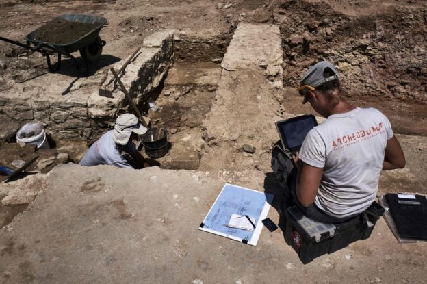 An archaeologist works at the dig near Vienne, south-eastern France, 31 July