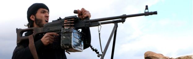 A rebel fighter fires towards pro-regime forces during clashes in Sheikh Najar area of the restive Syrian city of Aleppo on February 25, 2014