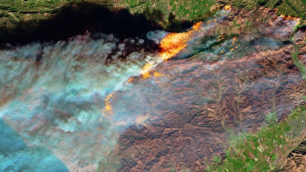 Satellite images show the flames from space.