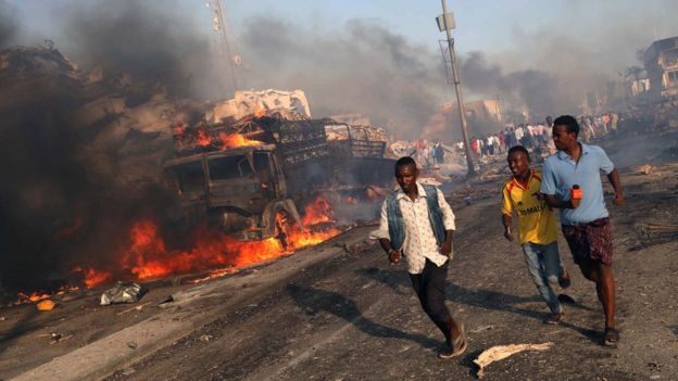 Image shows civilians evacuating from the scene of an explosion in the Hodan district of Mogadishu, Somalia on 14 October 2017