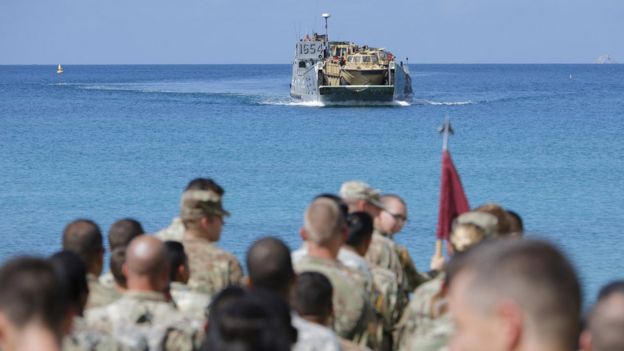Image shows US soldiers waiting to be evacuated on a beach in the US Virgin Islands on 17 September 2017