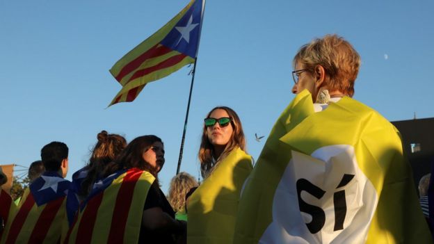 A woman holds a Catalan separatist flag in Barcelona, 29 October