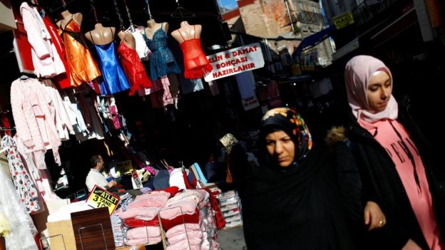 Women stroll at a middle-class shopping district in Istanbul