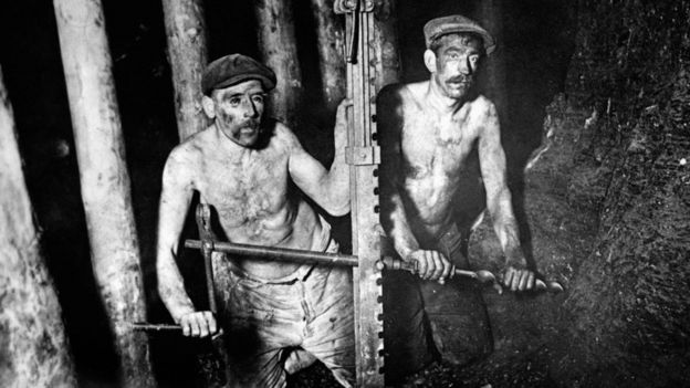 Two miners digging coal in 1924