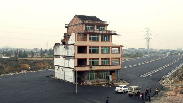 House in the middle of a newly-built road in Wenling, in eastern China's Zhejiang province