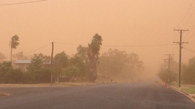 A dust storm covers a street in Charleville