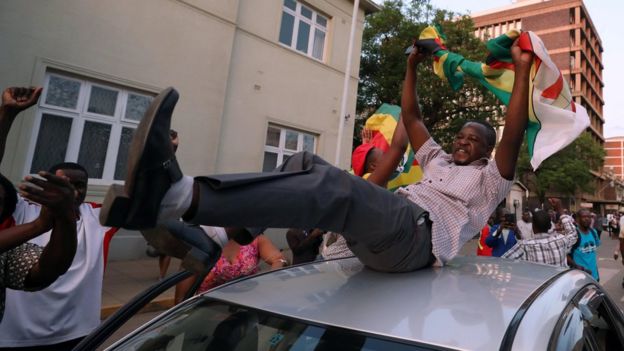 Zimbabweans celebrate after President Robert Mugabe resigns in Harare, Zimbabwe November 21, 2017