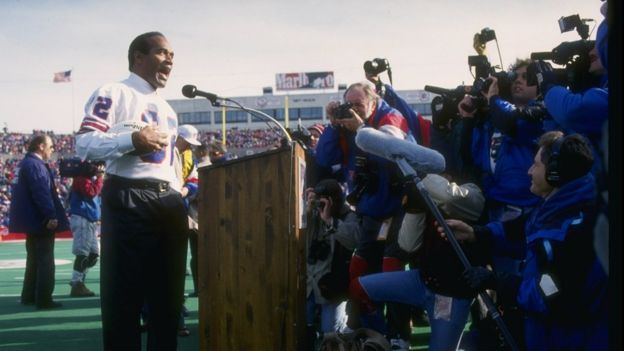 O.J. Simpson on the mike during a half-time ceremony of a game between the Buffalo Bills and the Indianapolis Colts at Rich Stadium in Orchard Park, New York, in 1993.