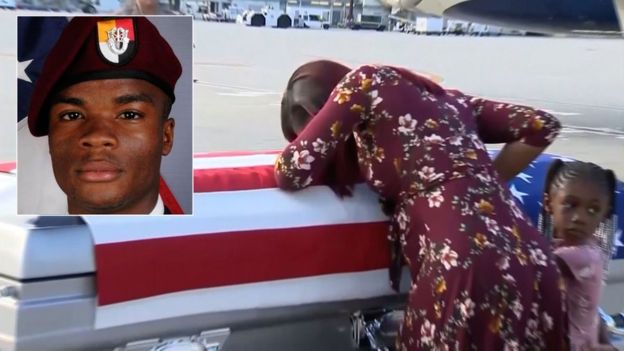 Sgt Johnson's widow with his coffin at Miami International Airport, 17 Oct 17