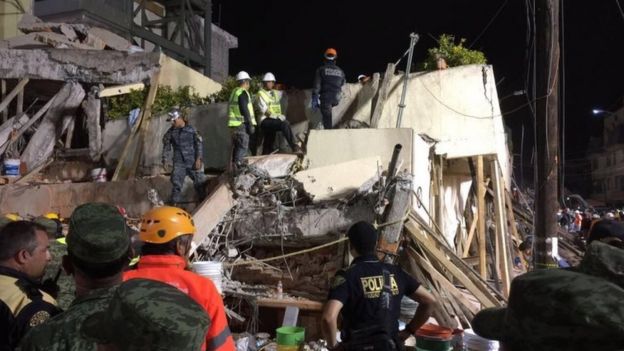 Rescue teams work at the Rebsamen school in Mexico City early morning on 20 September 2017.