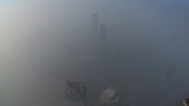 Smog is seen over the city against sky during a haze day in Beijing, China, on 1 January