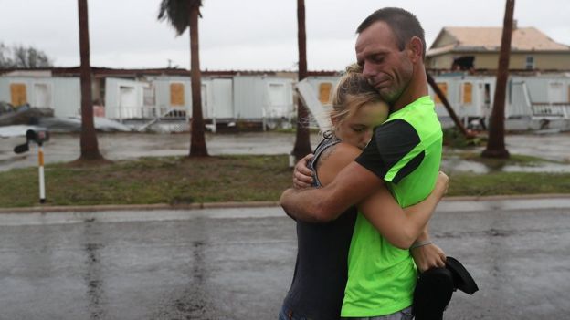 Jessica Campbell hugs Jonathan Fitzgerald (L-R) after riding out Hurricane Harvey in an apartment on August 26, 2017 in Rockport, Texas