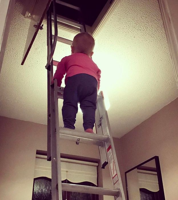Hannah Crowley climbing a ladder