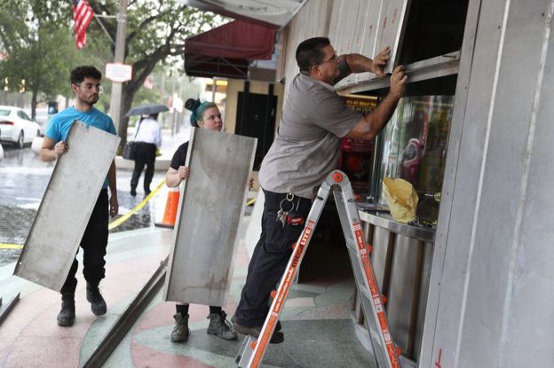 People put up shutters as they prepare the Actors' Playhouse at the Miracle Theatre for Hurricane Irma in Miami, Florida, 6 September