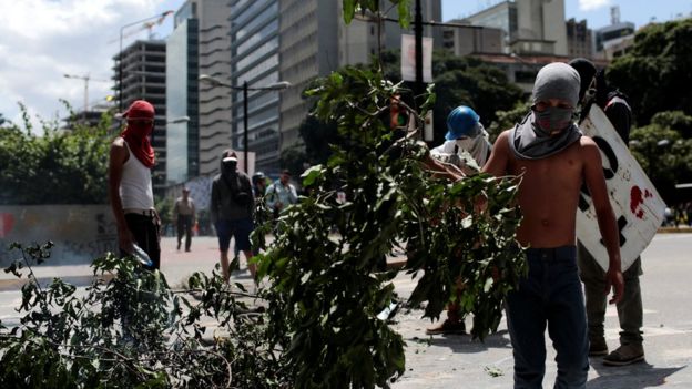 Demonstrators block a street at a rally against Venezuelan President Nicolas Maduro's government in Caracas, August 8, 201