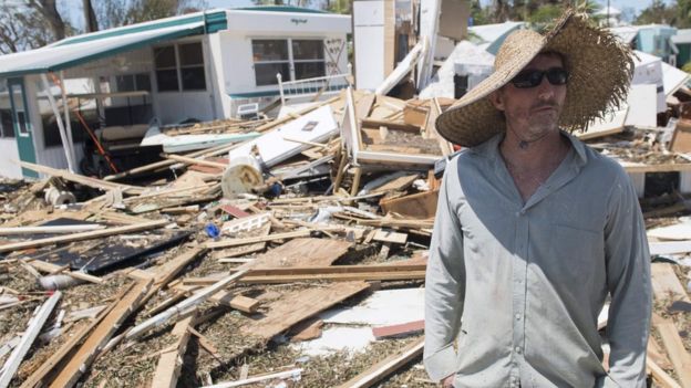 Resident Bill Quinn surveys the damage to his home in the wake of Hurricane Irma at the Seabreeze Trailer Park in Islamorada in the Florida Keys, 12 September 2017