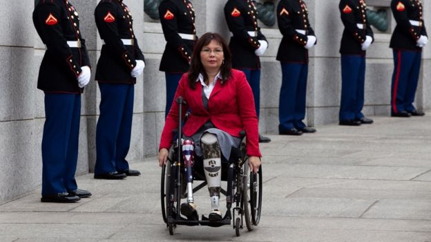 Tammy Duckworth arrives at a World War II Memorial ceremony in 2010, pictured in a wheelchair
