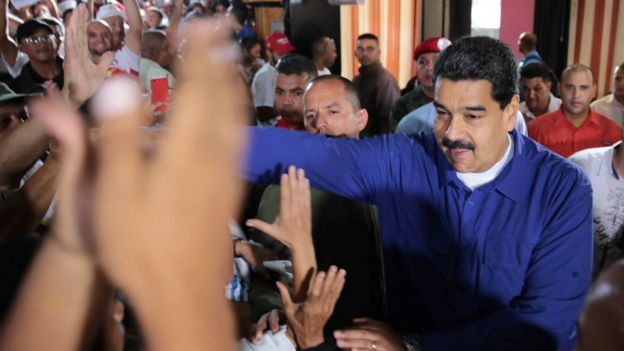 President Nicolas Maduro greets supporters during a meeting in Caracas, July 29, 2017