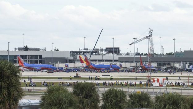 Hundreds of people are seen on the runway of Fort Lauderdale airport in Florida