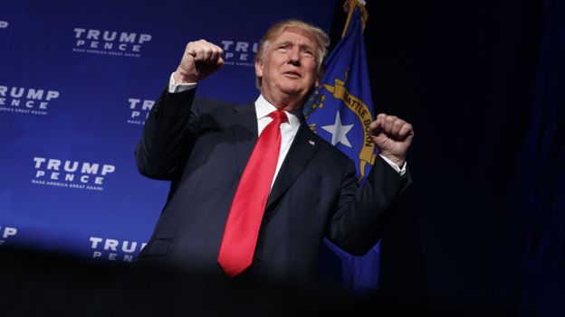 Republican presidential candidate Donald Trump walks onto the stage for a campaign rally, Saturday, Nov. 5, 2016, in Reno, Nev.