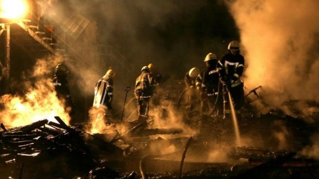 Firefighters work to extinguish a fire at a children's camp on 16 September 2017 in Odessa.