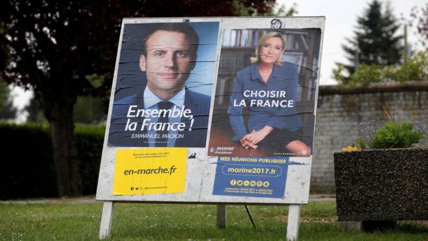 Posters of the two candidates seen in Sorrus, northern France