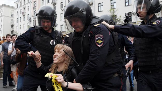 Russian police officers detain Maria Baronova of Open Russia at the opposition rally in Tverskaya street in central Moscow