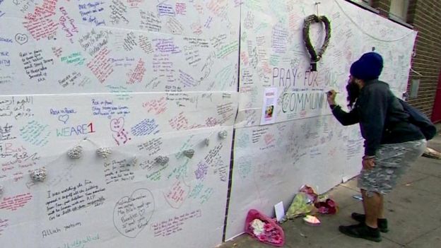 Man at memorial wall