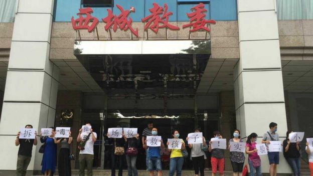 Parents protested in front of local education authorities demanding the school remove the toxic running track.