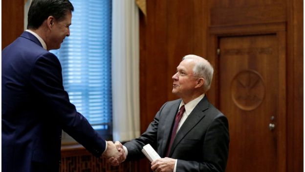 Comey shakes hands with Sessions