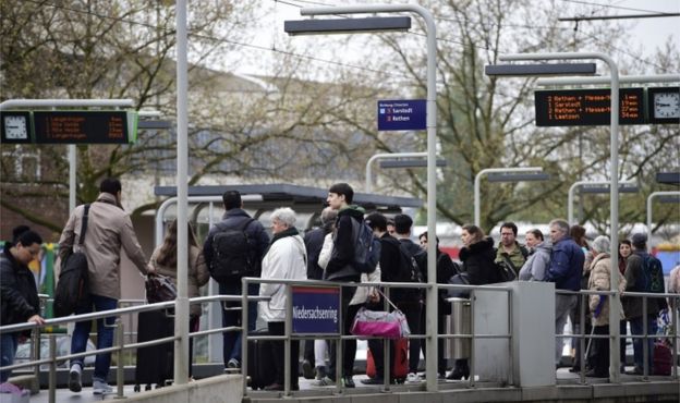 Residents wait for the tram as part of the evacuation of 50,000 people on May 7, 2017 in Hanover, Germany.