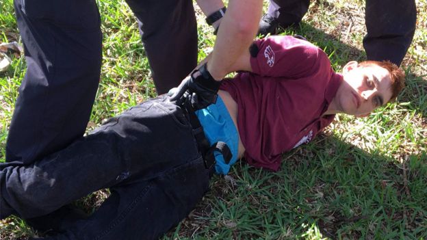 Nikolas Cruz on ground, being arrested