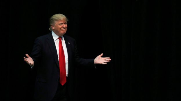 Donald Trump reacts as he is introduced during a campaign event in Concord, North Carolina, 7 March 2016