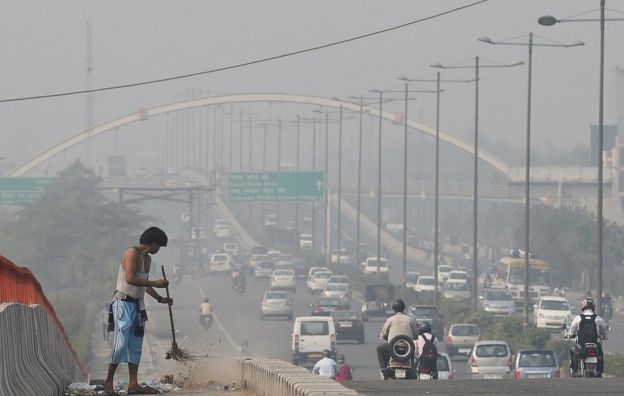 A smoggy view of a main road in Delhi the morning after Diwali celebrations in 2016