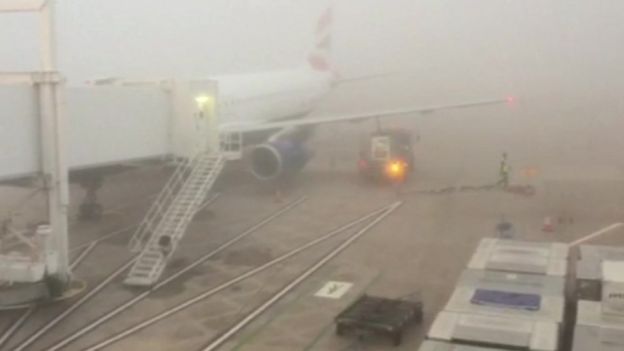 Plane in fog at Manchester airport