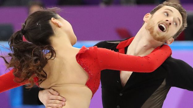 Yura Min and Alexander Gameline compete despite the clasp at the back of Min's dress coming undone