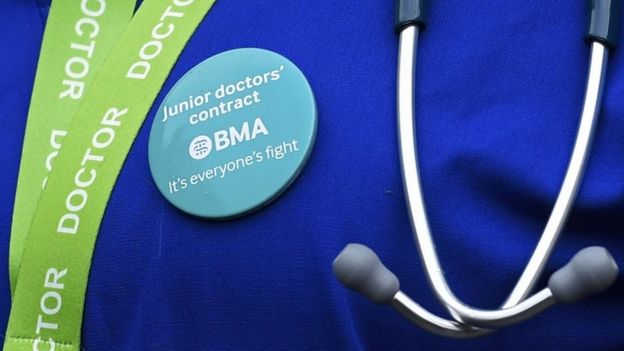 Junior doctor wearing a protest badge