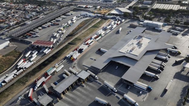 An aerial view of trucks queuing to cross from Mexico into California at the Otay Mesa port of entry on May 11, 2017 in San Diego, California