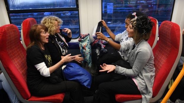 Royal fans catch the first train from London Waterloo to Windsor on Saturday morning