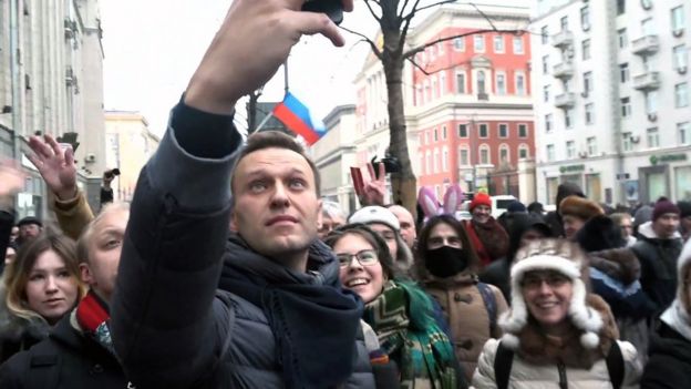 Alexei Navalny takes a selfie with protesters in Moscow.