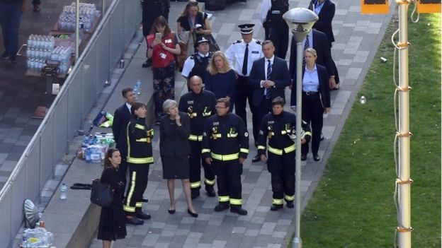 Theresa May with firefighters