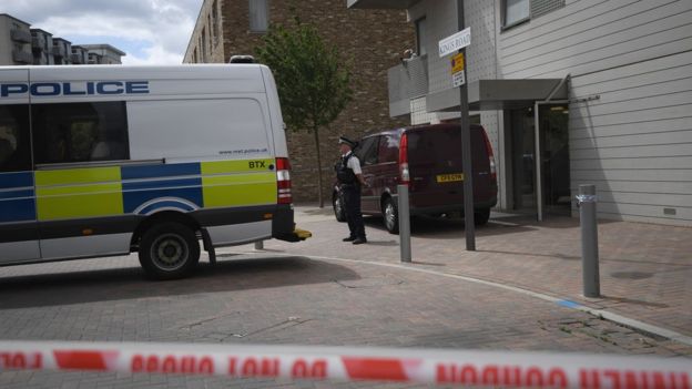 Police outside flat linked to suspect in Barking